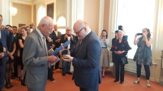 Minister of culture of the Czech Republic Mr Daniel Herman awards Mr Hans van Oostveen  the medal Artis Bohemiae Amicis.  